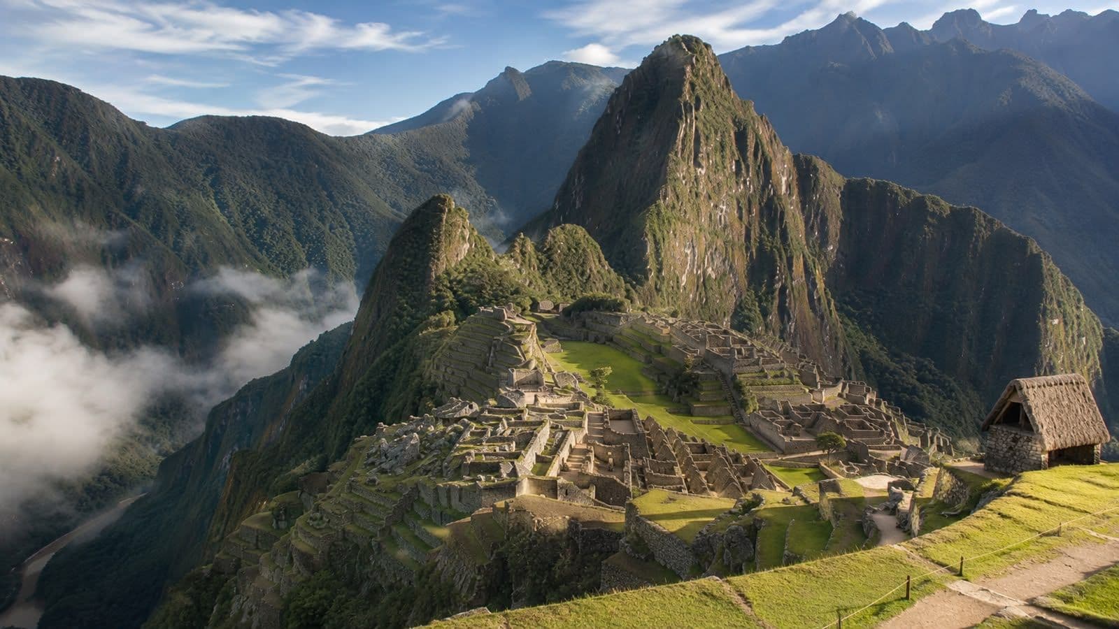 Machu Picchu ancient ruins surrounded by the Andes Mountains in Cusco, Peru