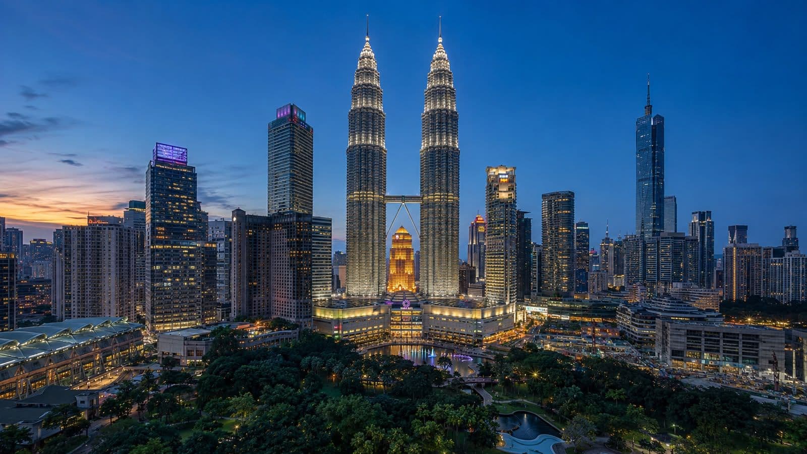 Kuala Lumpur skyline at night with the Petronas Twin Towers illuminated