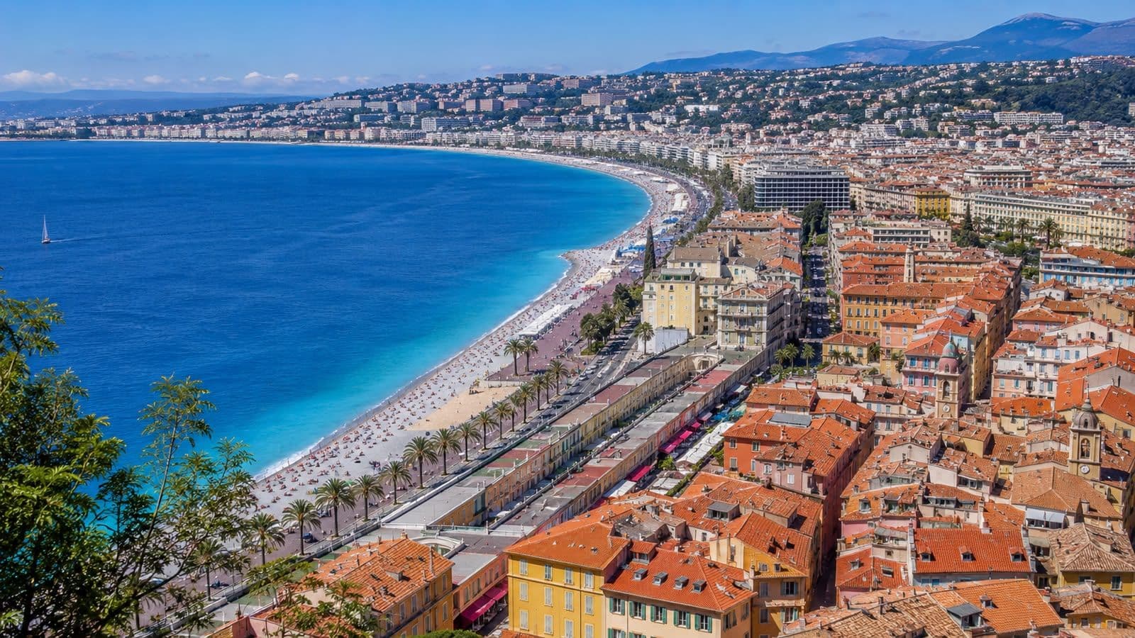 Panoramic view of Nice’s Old Town, Promenade des Anglais, and the turquoise Mediterranean coastline.