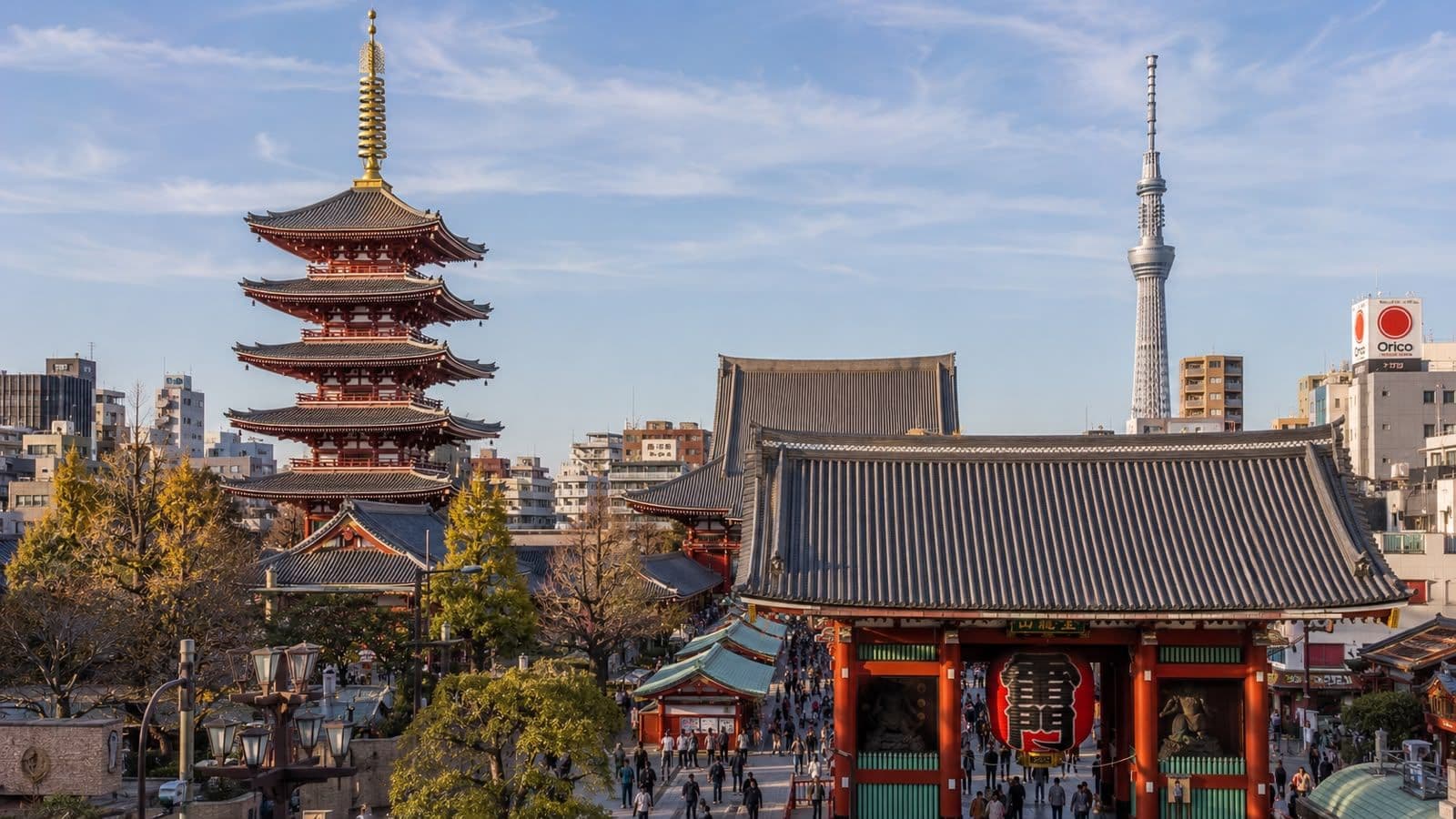 Panoramic view of Tokyo’s historic Asakusa district, featuring Senso-ji Temple, the iconic five-story pagoda, and Tokyo Skytree in the background.