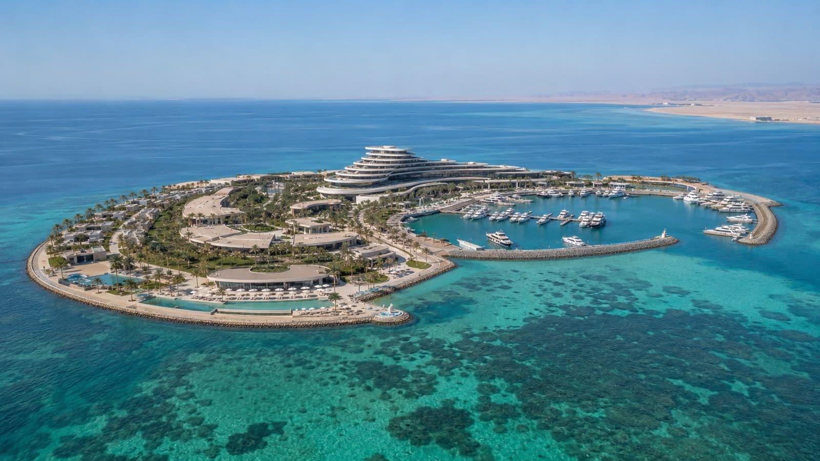 Aerial view of a luxury island resort in NEOM, surrounded by crystal-clear Red Sea waters